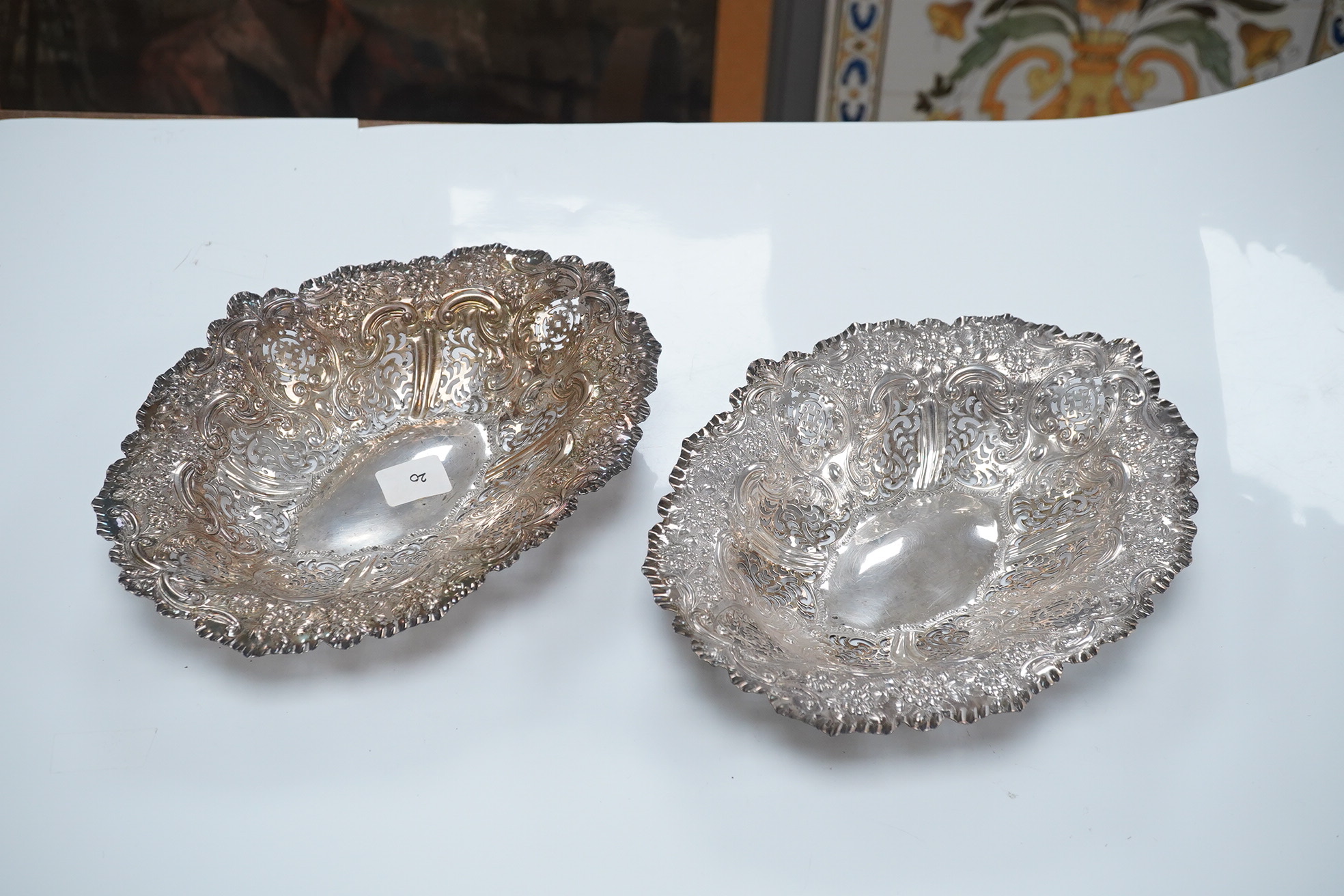 A pair of late Victorian pierced silver oval dishes, by Atkin Brothers, Sheffield, 1896, 27.9cm, 19.7oz. Condition - fair to good